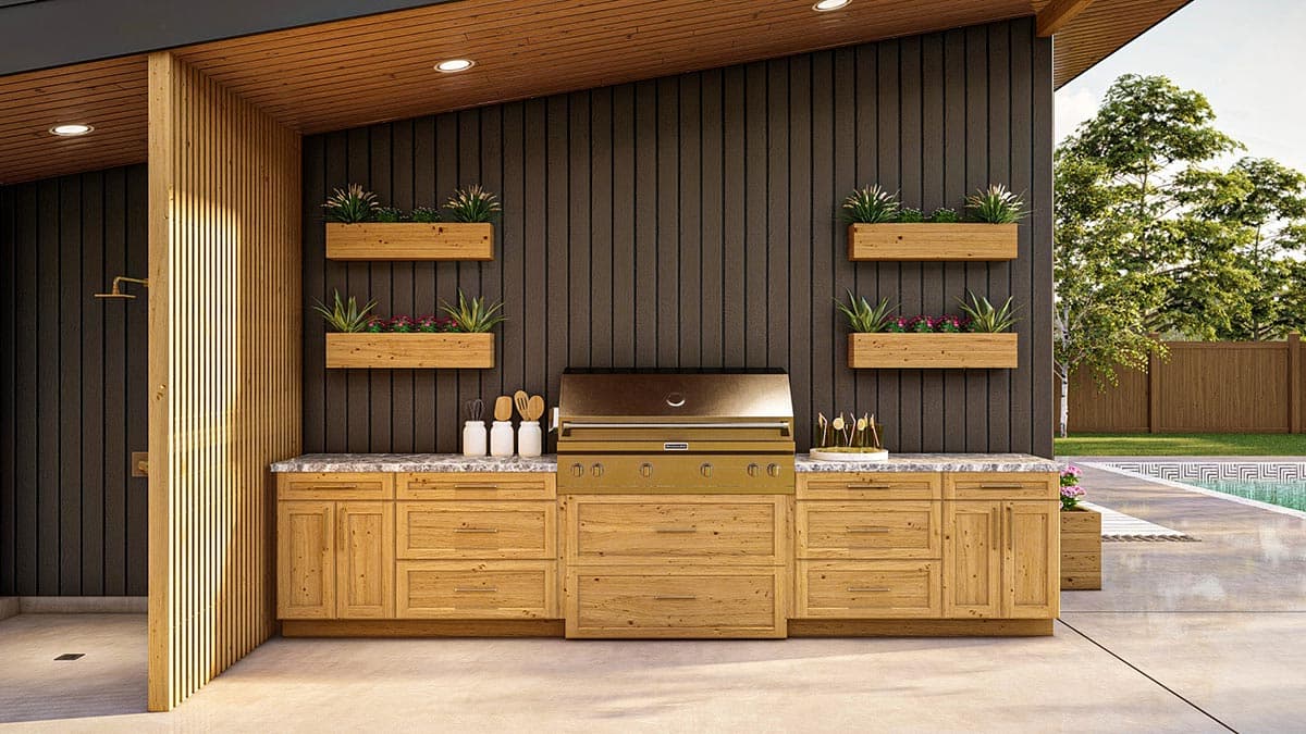 Outdoor kitchen with grill, wood cabinetry, granite countertops, and vertical planters on dark paneled wall.