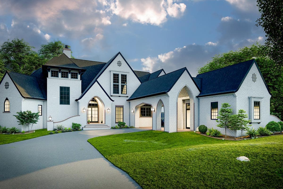 House plan exterior with two stories, featuring arched entryways, gabled rooflines, and a brick facade.