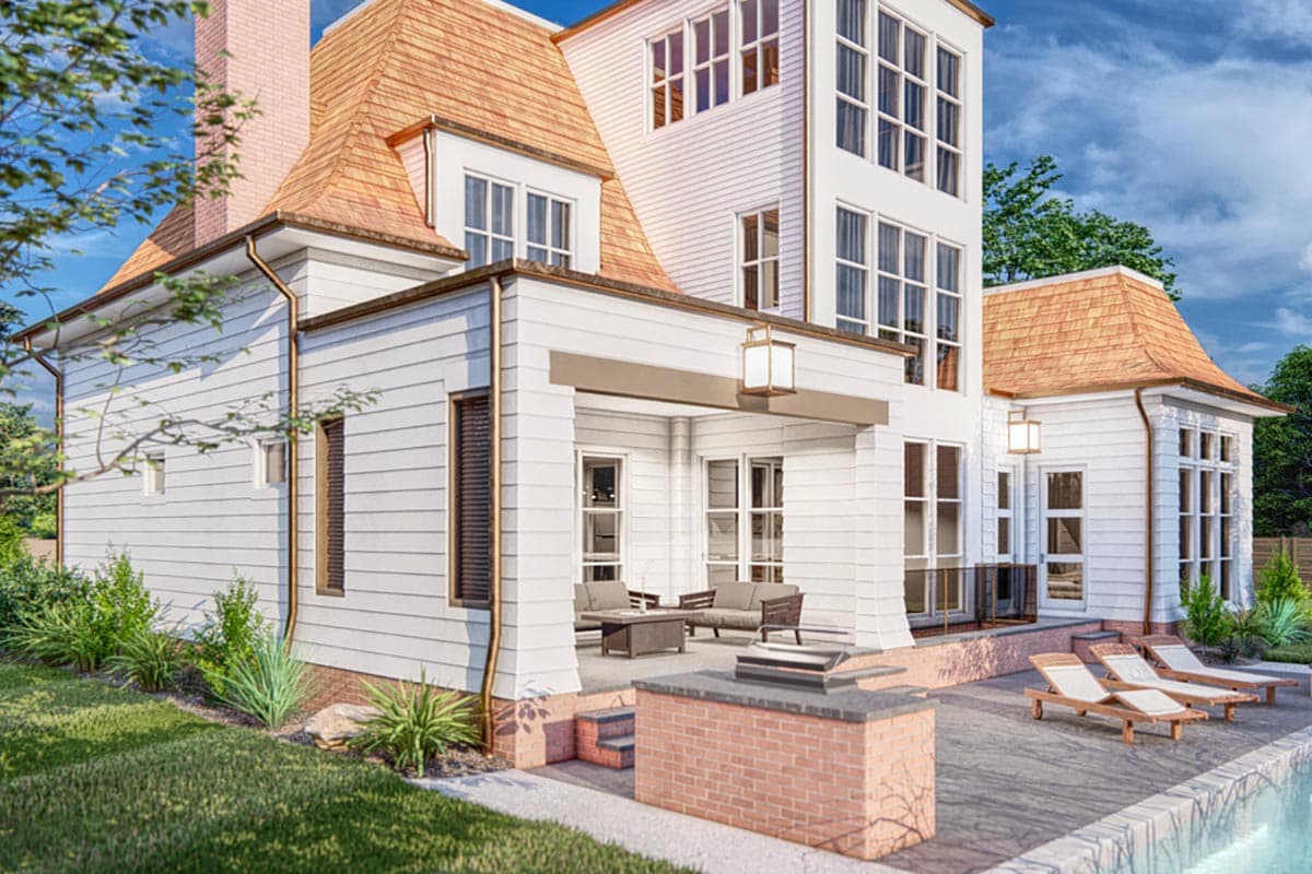 House plan exterior featuring shingle roof, multiple gables, covered porch with outdoor seating, and brick outdoor kitchen.