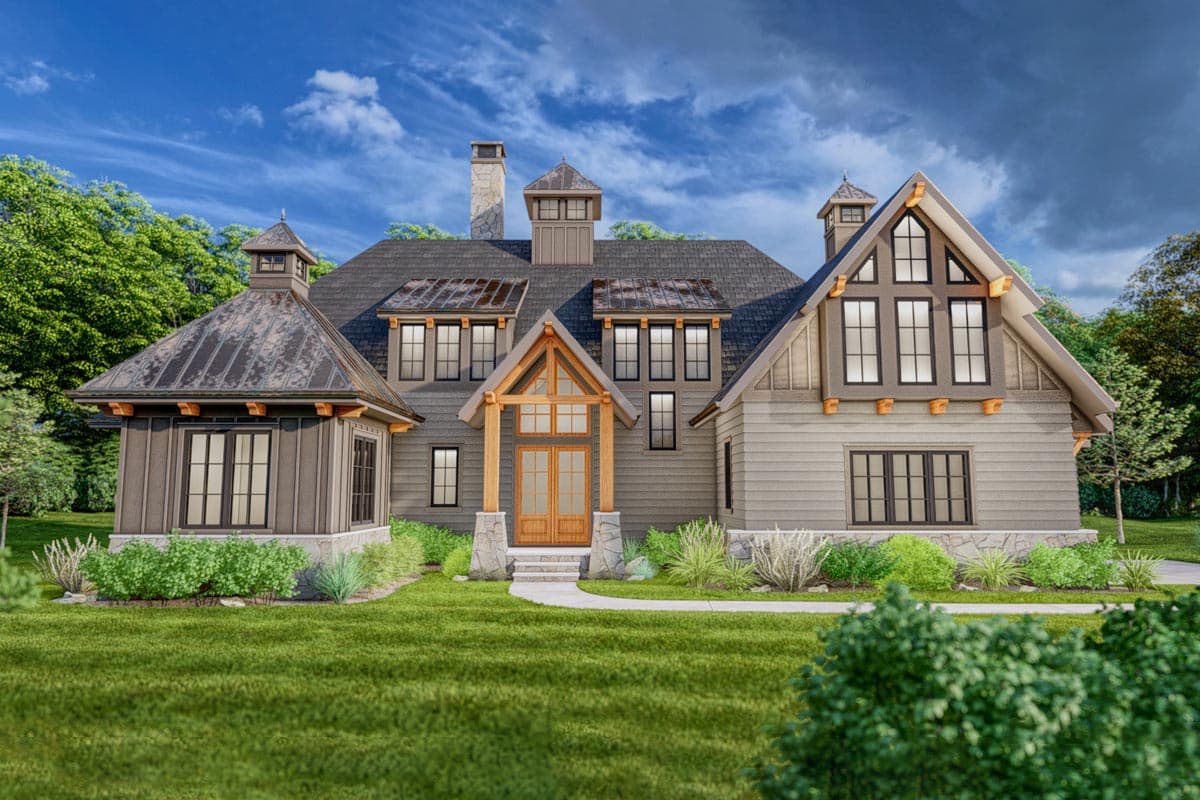 House plan exterior. Two-story home with Craftsman influence. Features include gables, dormers, a front porch, and cupolas on the roof.