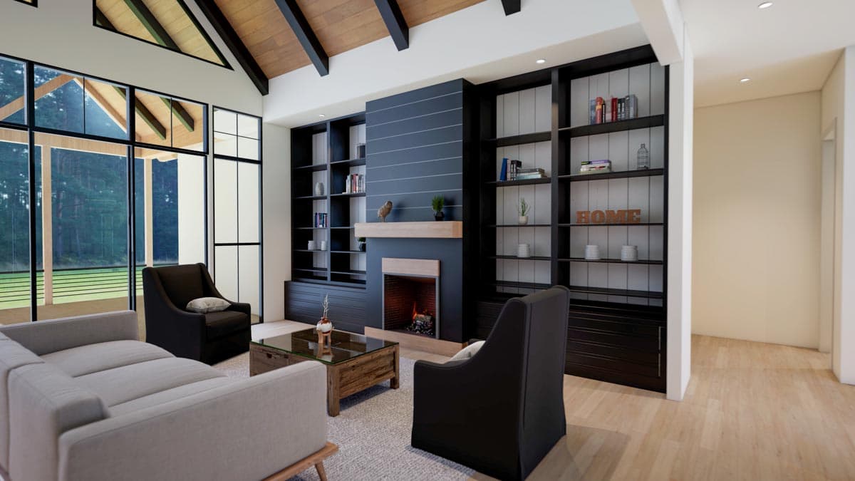 A modern living room with a fireplace, built-in bookshelves, and a large window overlooking a forest. Furnishings include a sofa and armchairs.