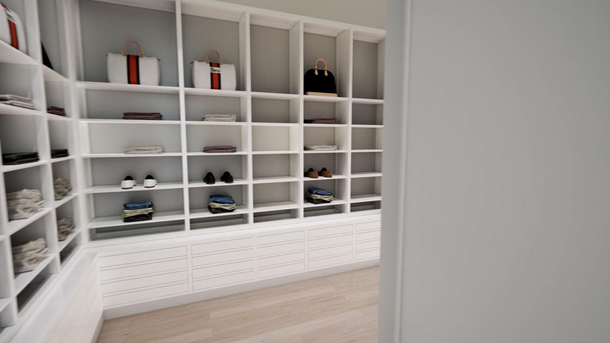 A walk-in closet with white shelving displays folded clothing, shoes, and handbags. The shelves are neatly organized with a variety of items.