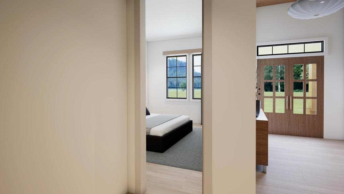 Interior view through a doorway, revealing a bedroom with a bed and a view, and the hallway leading to an entryway with wooden doors.