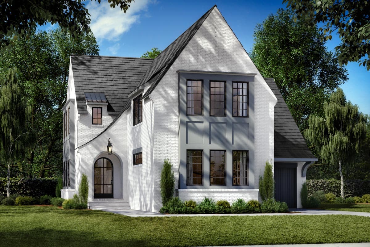 Modern Tudor house plan exterior with white brick, prominent gables, arched entry, dormer, and attached garage.
