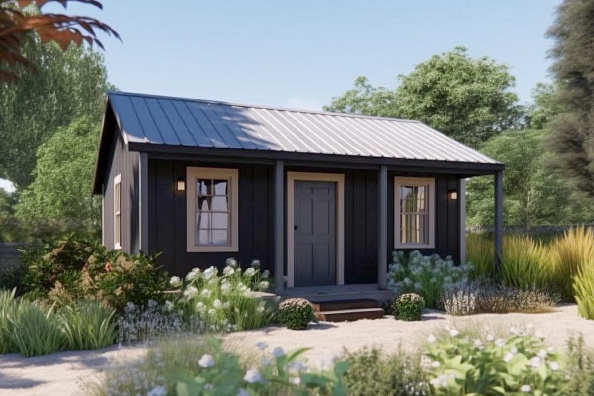 House plan exterior. One-story structure with a metal roof, porch, and symmetrical window placement, with landscaping in the foreground.