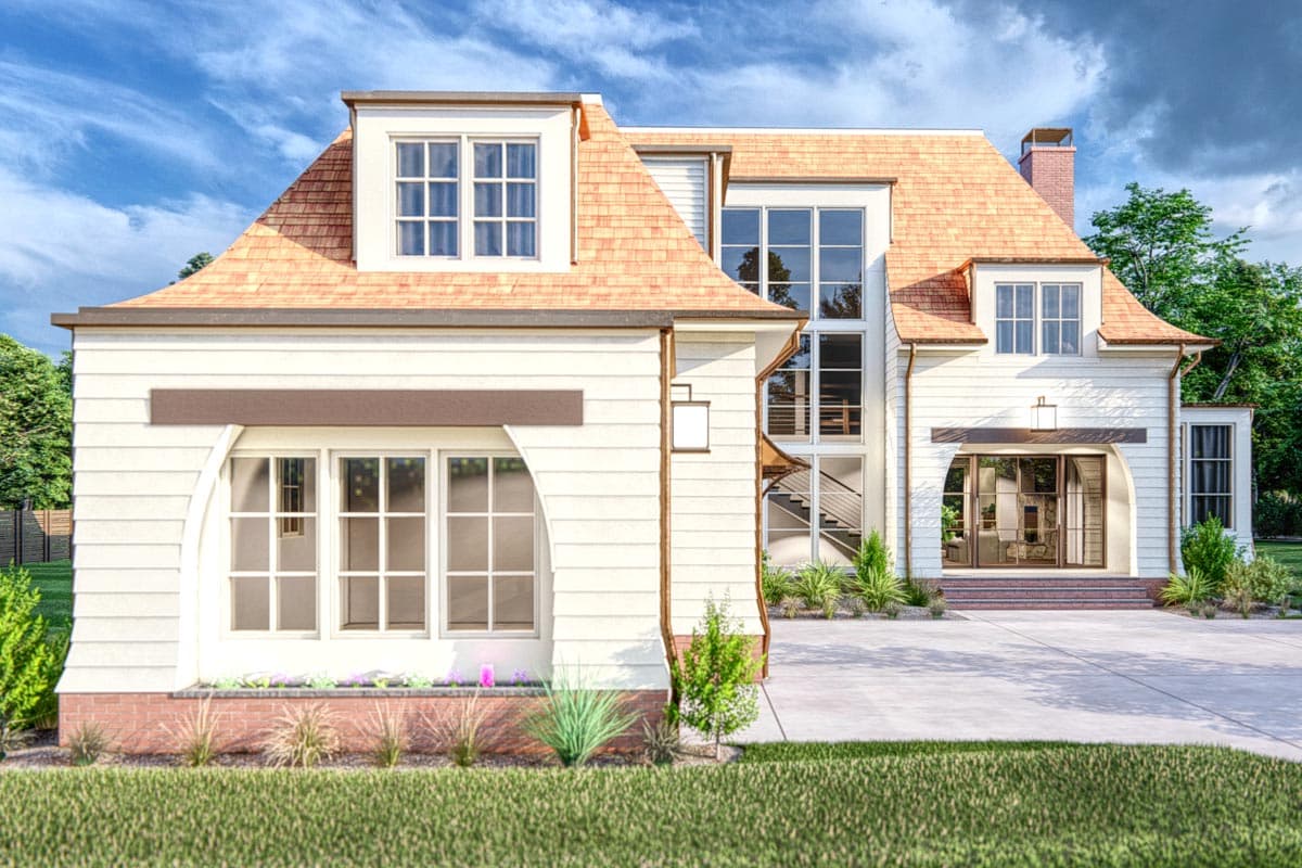 House plan exterior featuring wood shingle roof, dormer, and arched entryway with large windows.