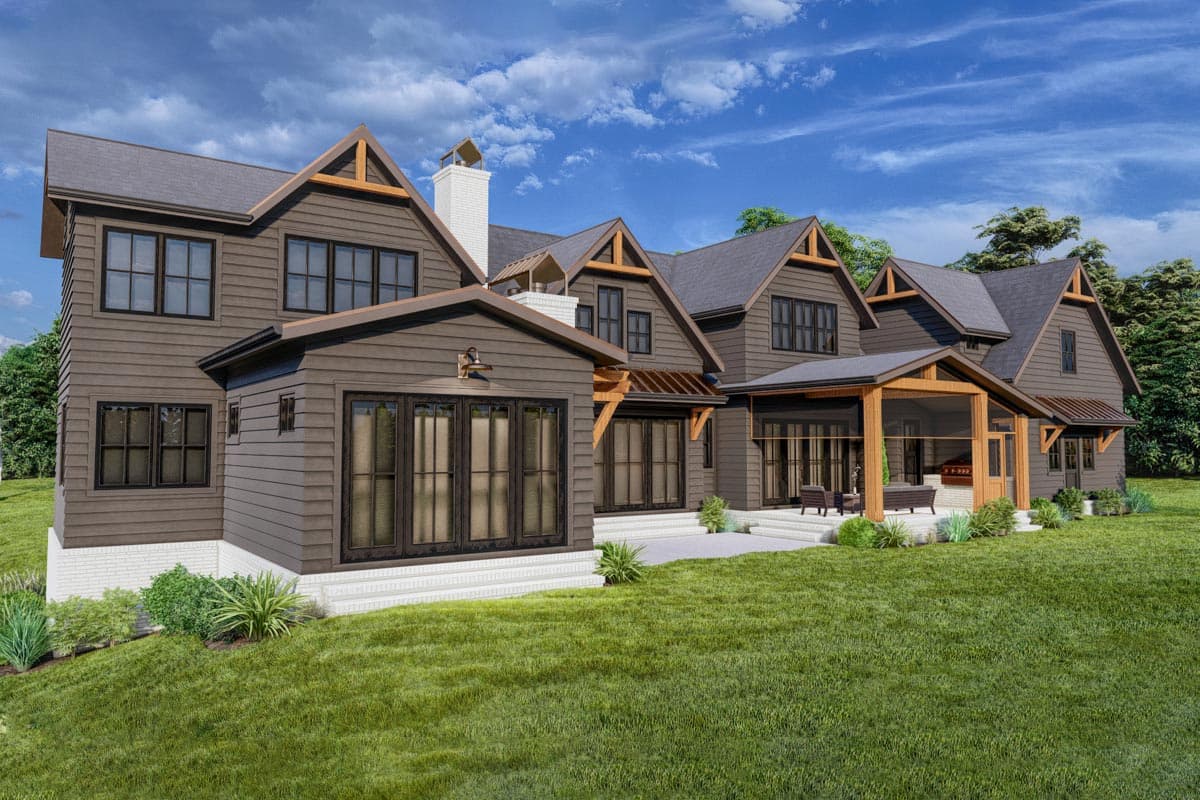 Modern Farmhouse house plan exterior with multiple gables, wood accents, large windows, and covered porch.