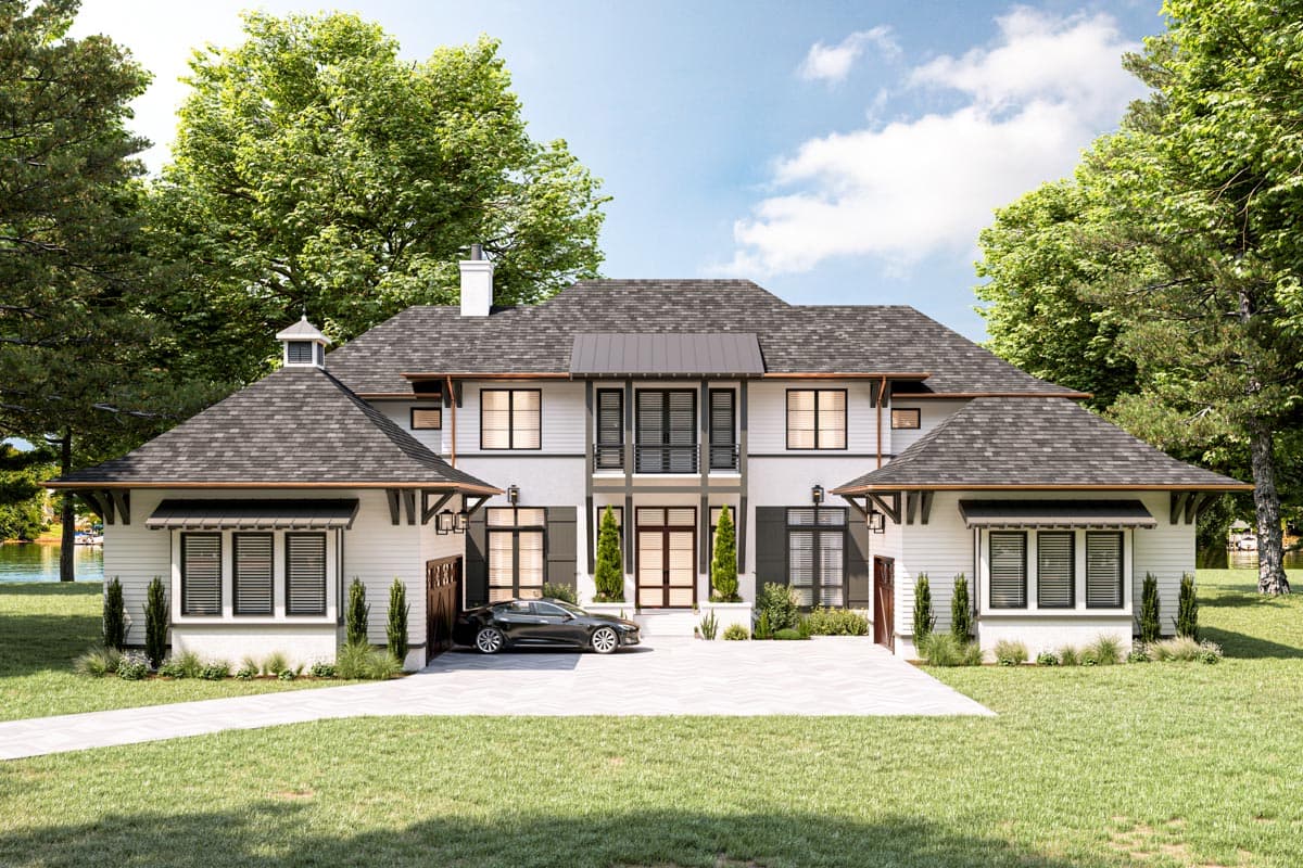 House plan exterior. Two-story home with a gabled roof, dormers, and a prominent front entry with a balcony.