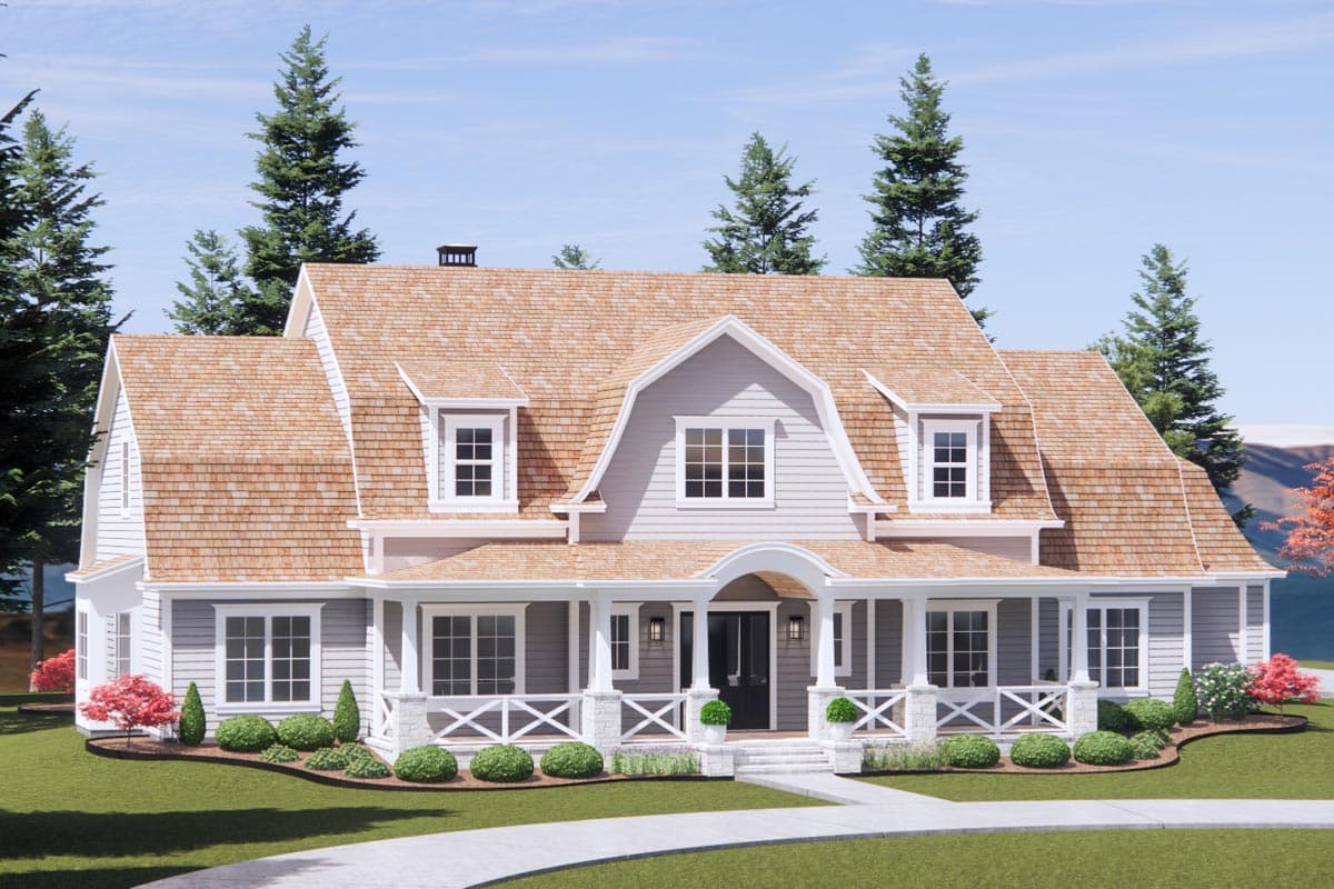 House plan exterior: Gambrel roof, wraparound porch with decorative X-bracing, dormer windows, and gabled dormers.