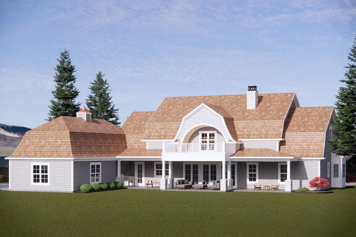 House plan exterior: Gambrel roof, dormer, covered patio, balcony, and attached garage.