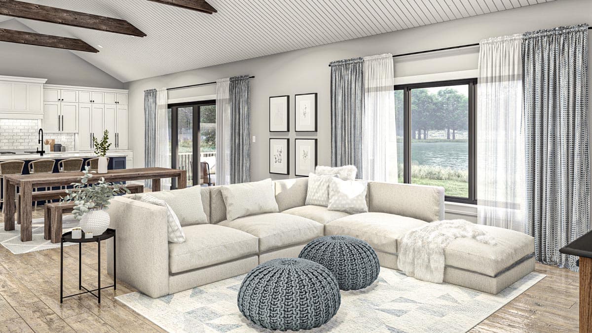 Rendering of a great room with vaulted ceiling, exposed beams, sectional sofa, dining area, and kitchen.