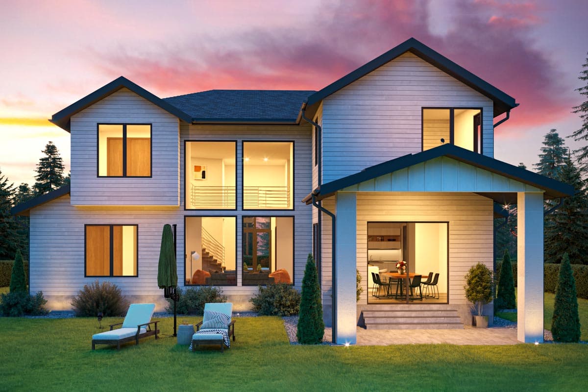 Modern two-story house plan exterior with large windows, gabled rooflines, and covered patio with outdoor dining.