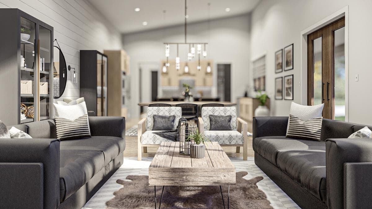Living room rendering with vaulted ceiling, modern light fixture, two sofas, and view into kitchen and dining area.