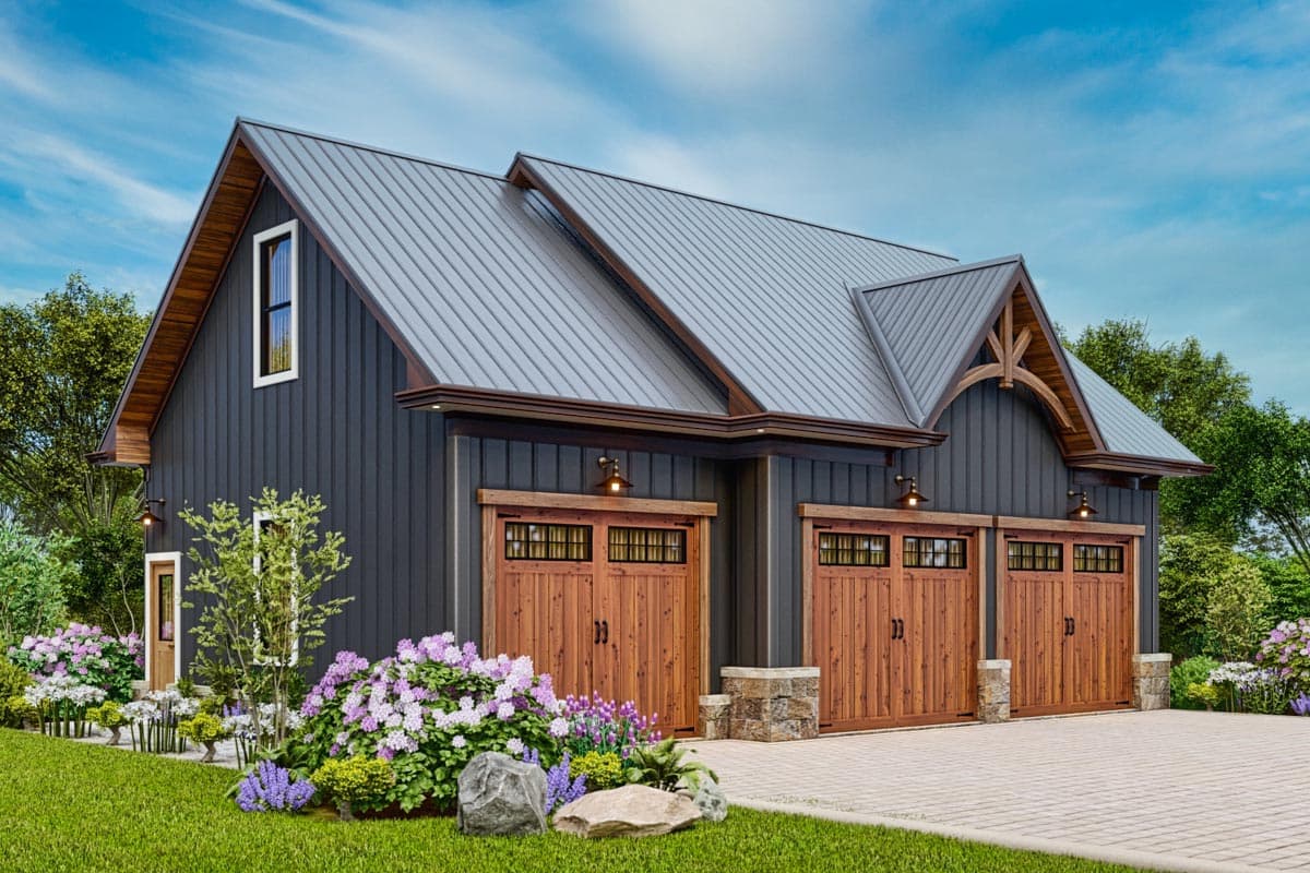 House plan exterior. Two-story Modern Farmhouse with a gabled roof, three garage doors, and decorative timber-framed accents.