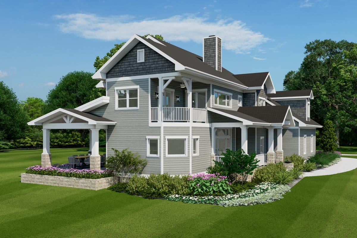 House plan exterior of two-story home with gabled dormers, stacked shingle siding, and covered porch with stone pillars.