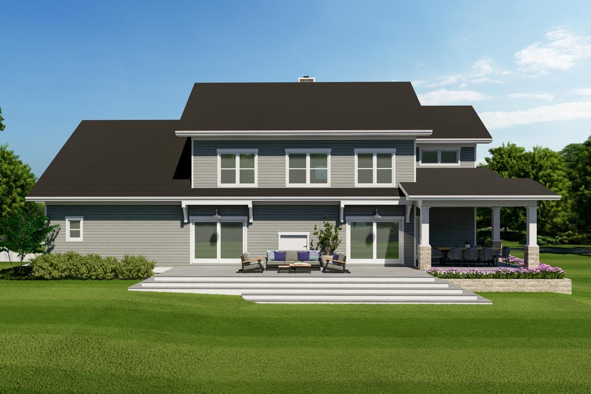 House plan exterior: Two-story home with horizontal siding, a prominent gable roof, covered porch with stone pillars, and a multi-level deck.