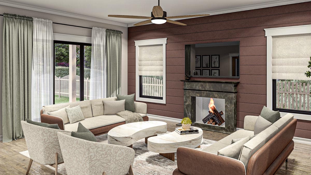 Living room with fireplace, sectional sofas, abstract coffee tables, and large windows with outdoor view.