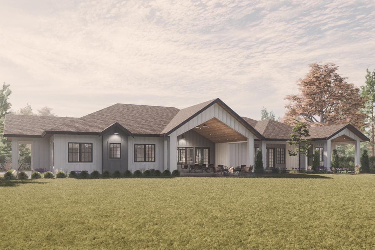 Modern farmhouse house plan exterior with a covered patio, large windows, and intersecting gables.