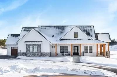 Sloping Lot Mountain Farmhouse Plan Under 2800 Square Feet with Lower Level Expansion