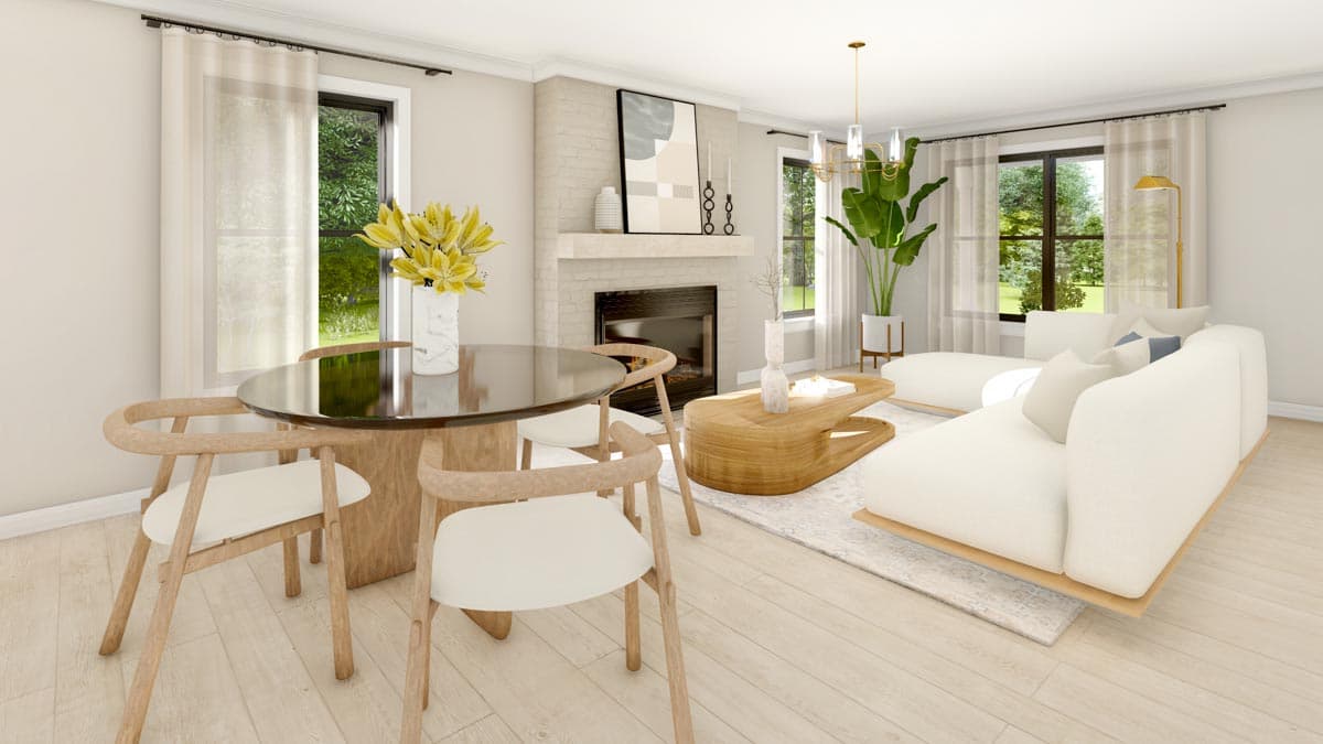 Living and dining area with fireplace, sectional sofa, round dining table, and large windows.