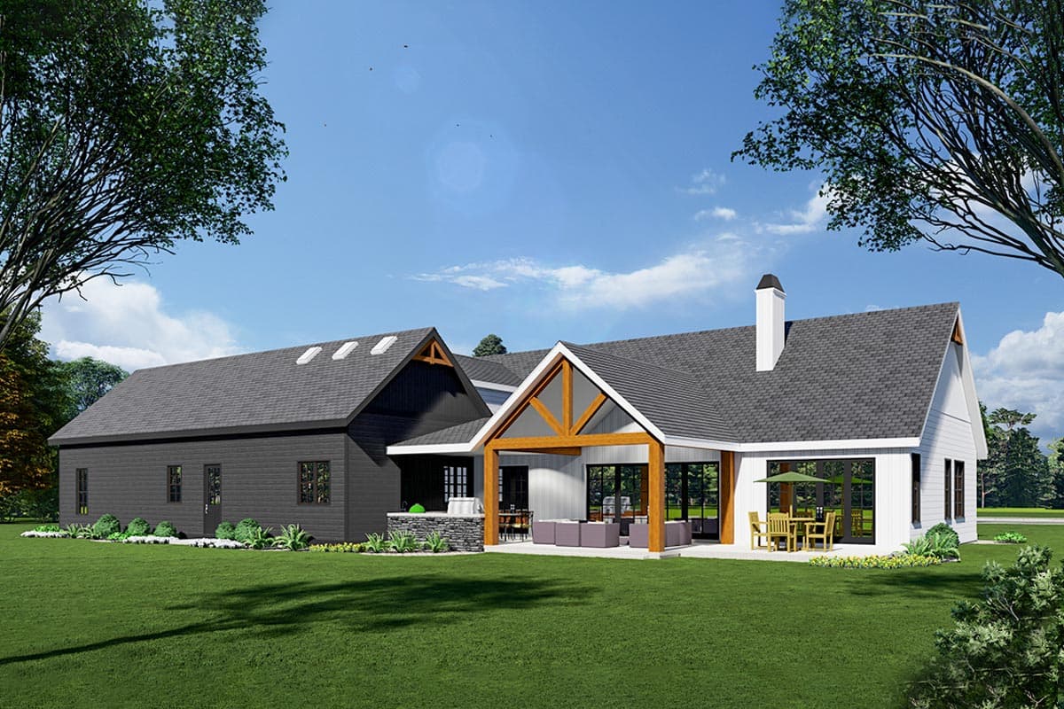Modern farmhouse house plan exterior with dark siding, white siding, exposed beams, covered patio, and outdoor kitchen.