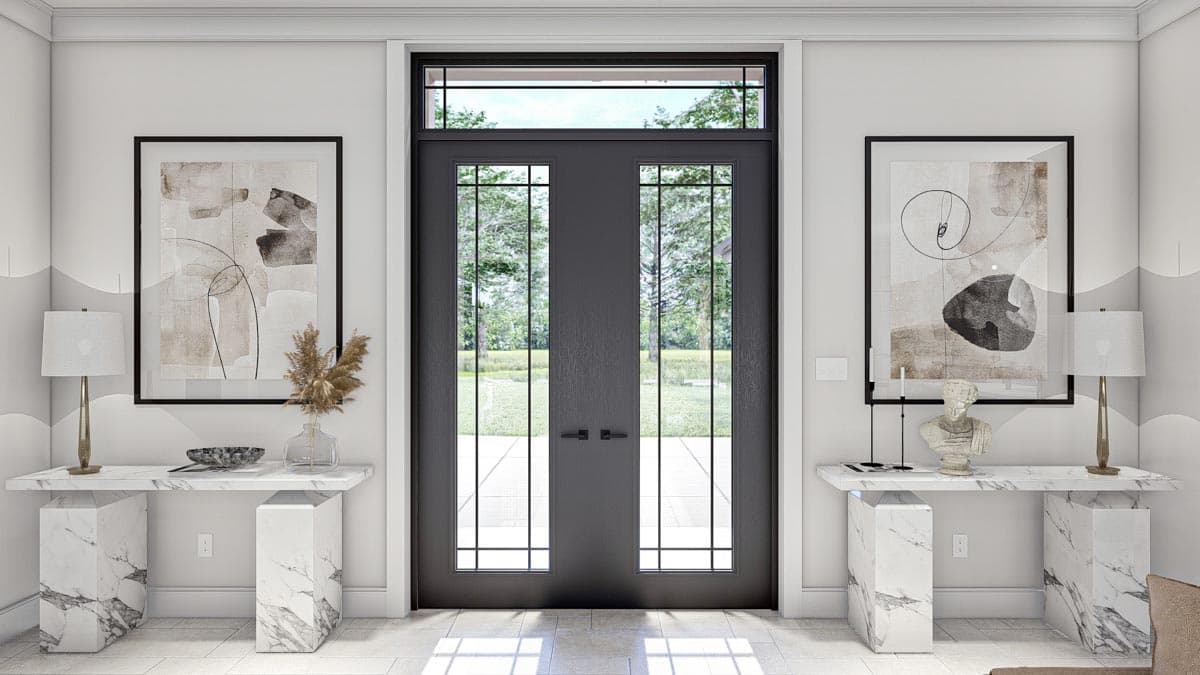 Double front doors with multi-pane glass and transom window, flanking marble consoles and abstract art.