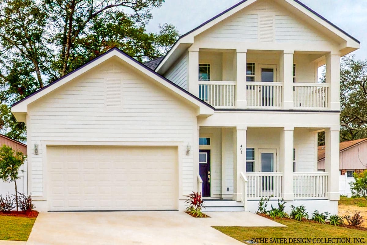 Two-story house plan exterior with a prominent gabled front, side-facing garage, and stacked front porches with decorative railings.