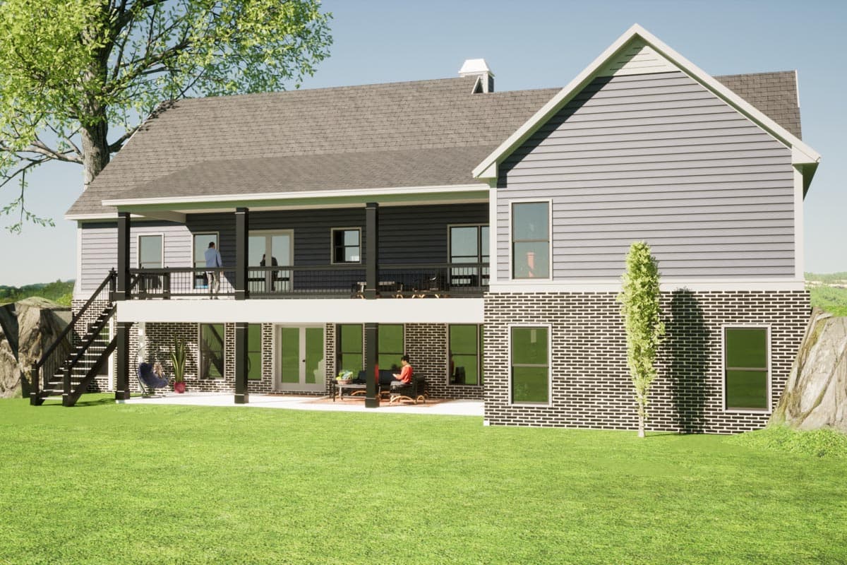 House plan exterior: two-story, grey siding, gabled roof, covered deck, brick foundation, and multiple windows.