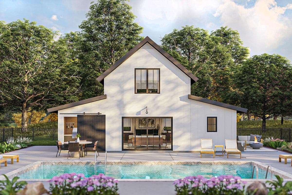 House plan exterior. Modern farmhouse style with gabled roof, sliding barn door, and large glass doors. Includes a pool, patio, and outdoor kitchen.