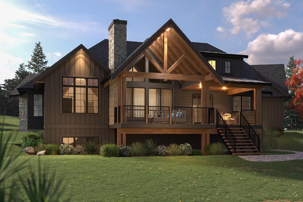 House plan exterior: Modern Farmhouse style, two stories, prominent stone chimney, covered deck with exposed beams, and multi-pane windows.