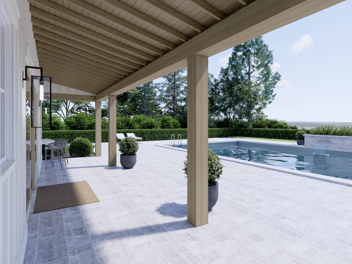 Covered patio with timber posts and ceiling overlooks a swimming pool with lounge chairs and manicured hedges.