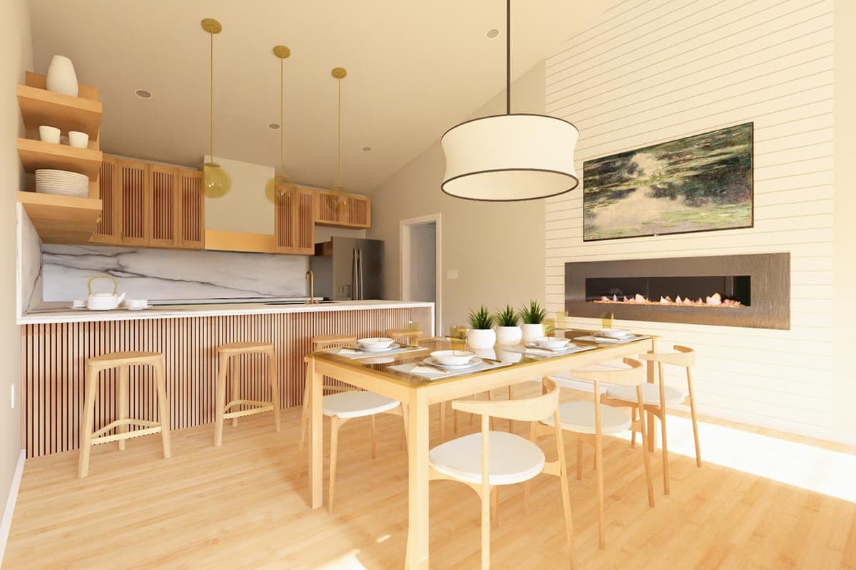Open concept kitchen and dining area with a large island, linear fireplace, vaulted ceiling, and wood cabinetry.