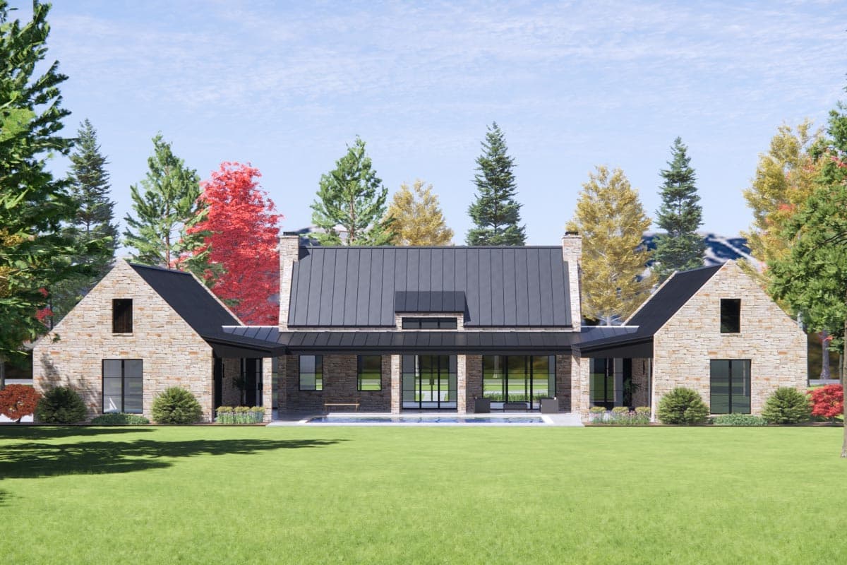 Modern Farmhouse house plan exterior with stone facade, metal roof, large gables, and covered walkways connecting wings.