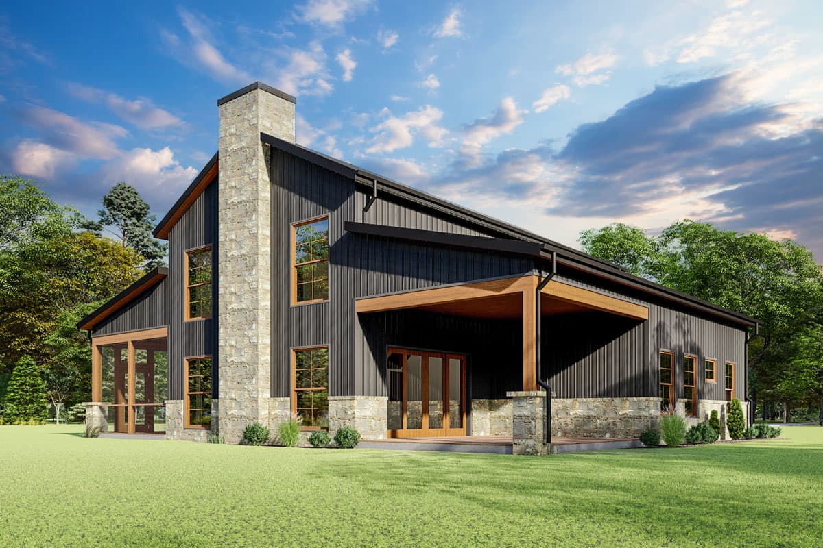 House plan exterior with two stories, a stone chimney, covered porch, and a shed roof. Vertical siding and large windows are visible.