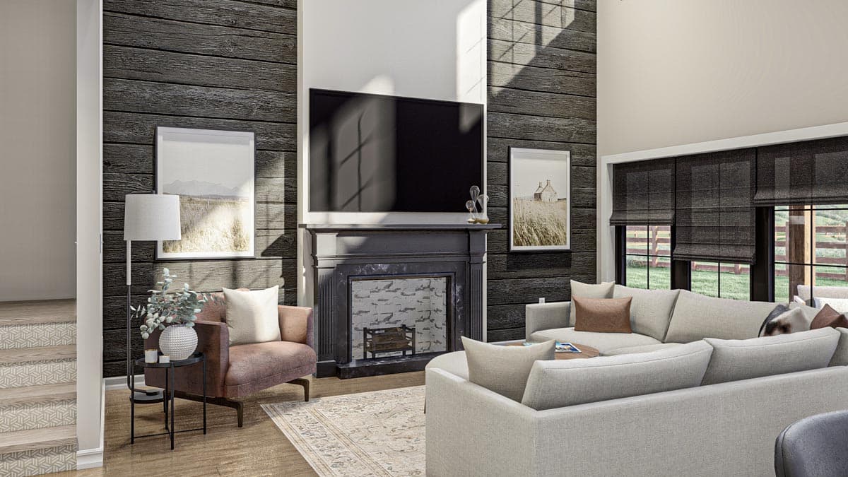 Great room with fireplace, sectional sofa, and large windows with roman shades. Wood plank accent wall.