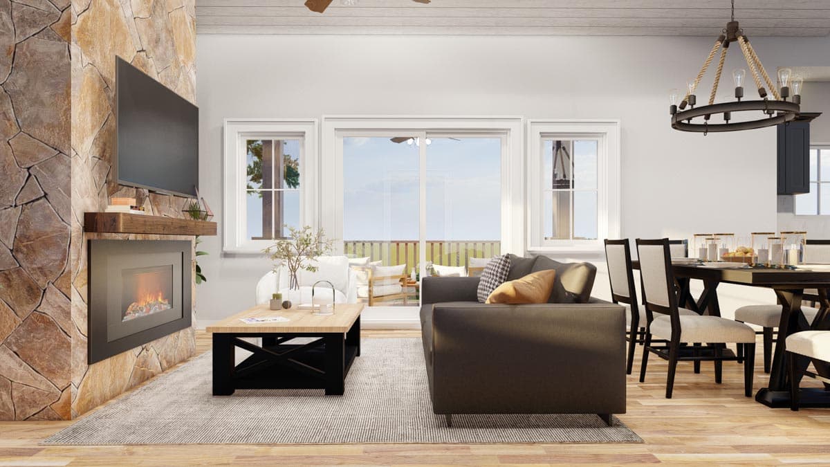 Interior rendering of a living room featuring a stone fireplace, television, sofa, and dining area with a chandelier.