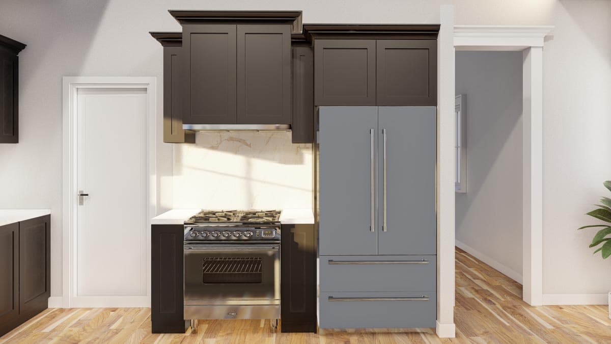 Kitchen with dark cabinetry, stainless steel range, gray refrigerator, and marble backsplash.