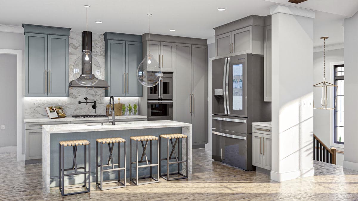 Kitchen interior with dual-tone cabinets, island with bar stools, stainless steel appliances including double ovens and refrigerator.