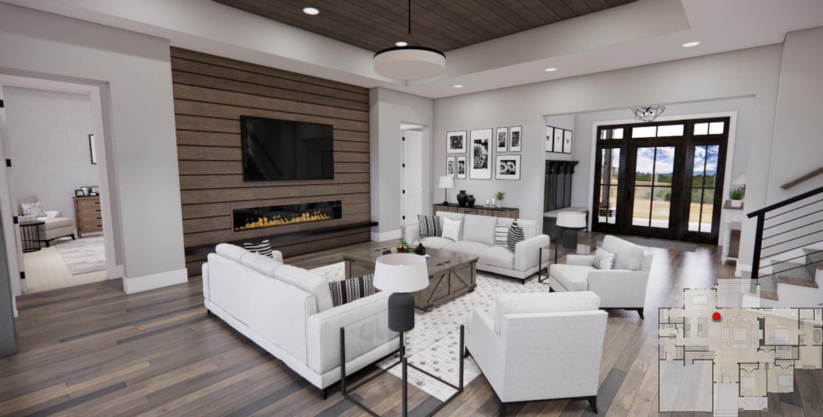 Great room with wood-paneled accent wall, fireplace, and large glass doors. Floor plan overlay shows main level layout.