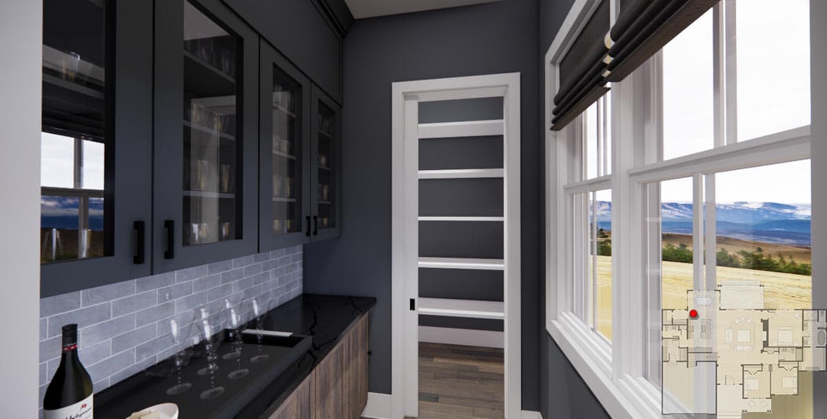 Butler's pantry with dark cabinets, subway tile backsplash, open shelving, and view of the landscape through a large window.
