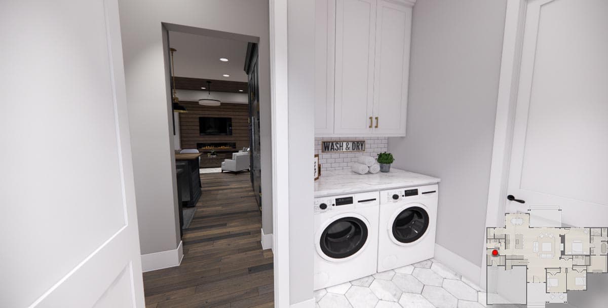Laundry room with white cabinets, washer, dryer, marble countertop, and subway tile backsplash. Open doorway to living area.