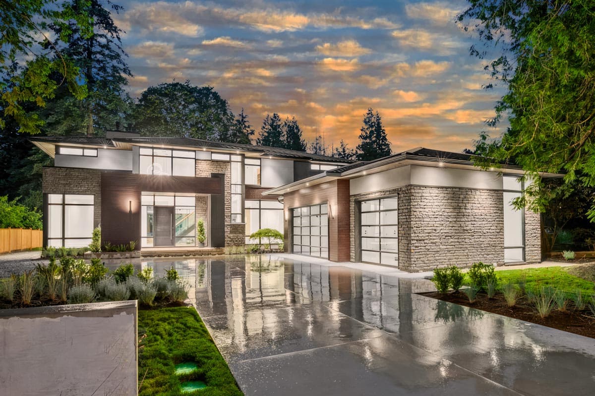 House plan exterior with two stories, a contemporary style, flat rooflines, stacked stone facade, and glass garage doors.