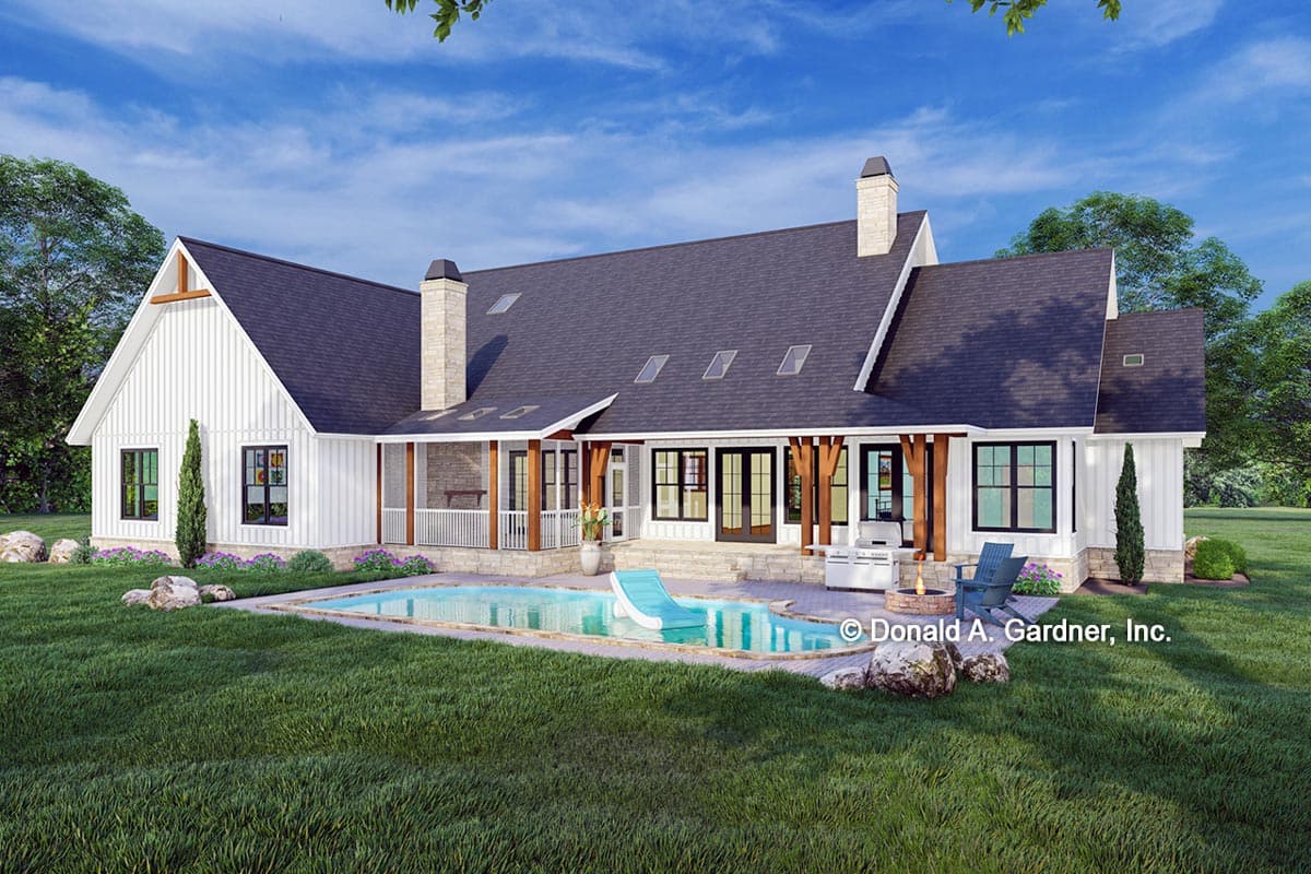 Modern Farmhouse house plan exterior with white board-and-batten siding, a covered porch, stone chimney, and a pool.
