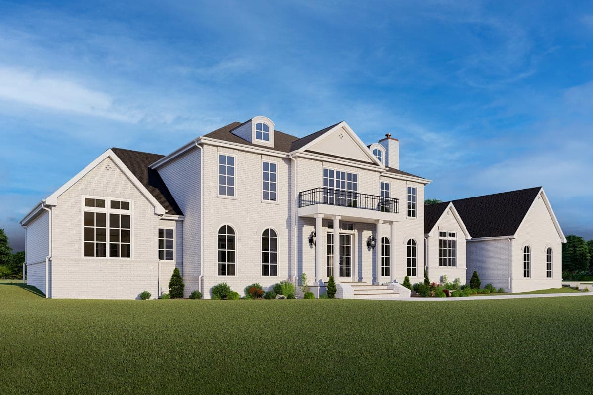 House plan exterior: Two-story white brick home with a central balcony, arched windows, and dormer windows.