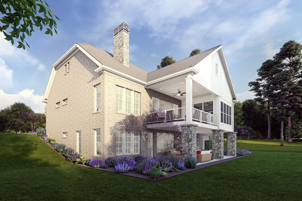 House plan exterior: Two-story home with brick facade, stone accents, gabled dormers, and covered upper balcony.
