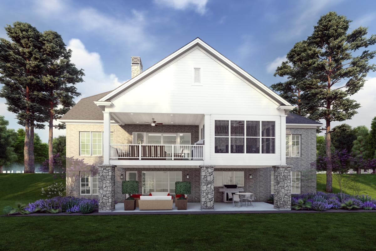 House plan exterior with brick and stone facade, two stories, covered deck, large gabled dormer, and screened porch.