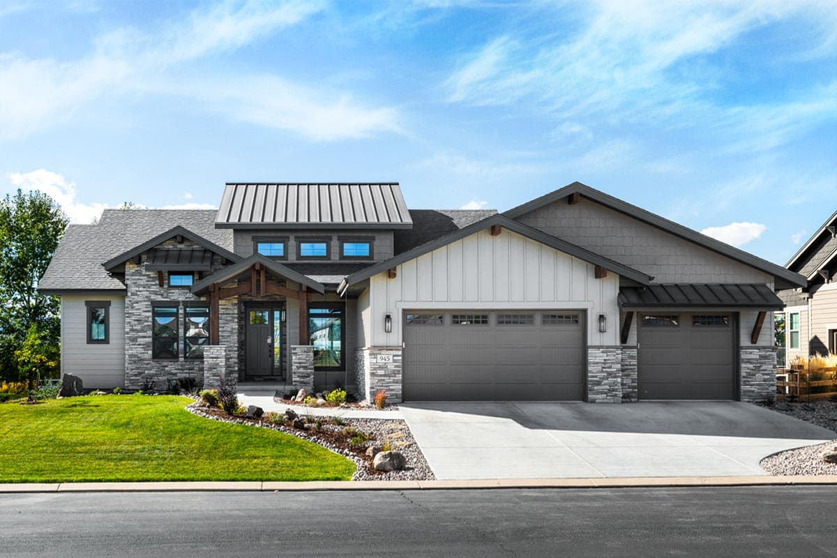 House plan exterior. Two-story Modern Farmhouse with stone accents, a shed roof over the garage, and a covered porch with timber beams.