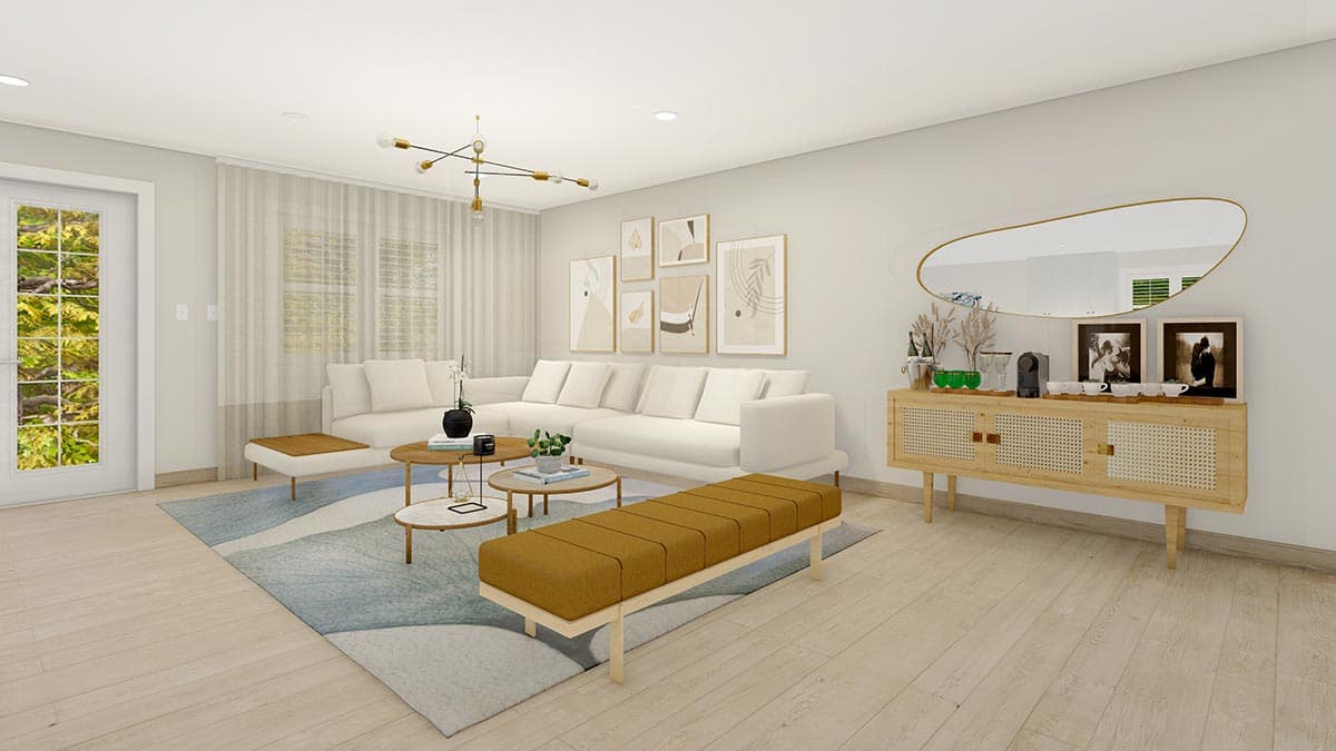 Living room interior with sectional sofa, coffee tables, artwork, and a credenza with a mirror above.