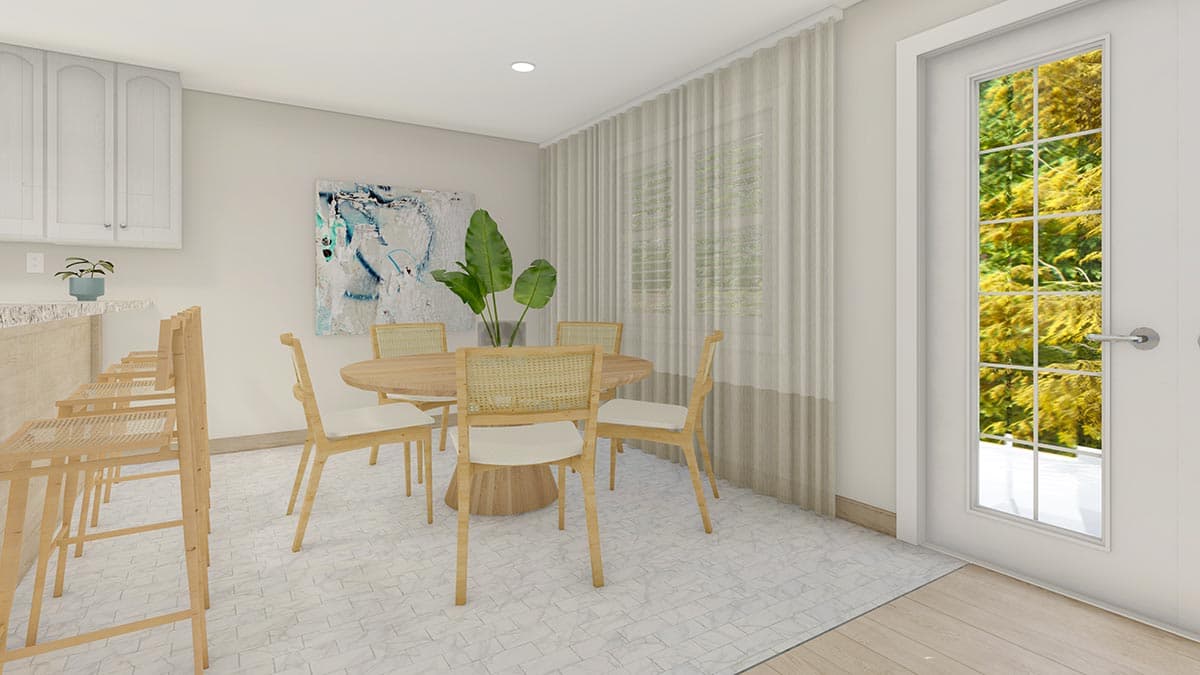 Dining area with round table and chairs next to kitchen counter with bar stools. Window with sheer curtains and glass door showing outdoor foliage.