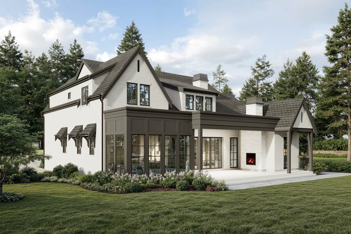 House plan exterior: two-story stucco home with gables, dormers, sunroom, and fireplace.